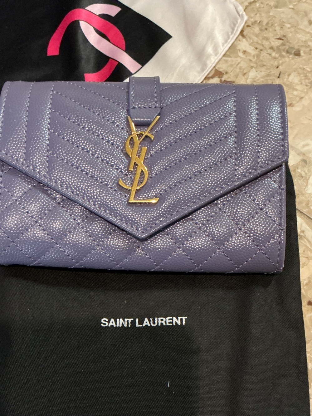 Authentic YSL purple wallet with gold colored hardware.